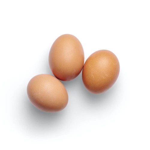 Brown eggs on white background.