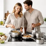 Modern cookware set including stainless steel pots frying pans and saucepans