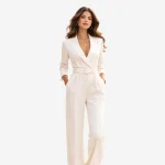 Woman wearing elegant tailored jumpsuit in tropical urban setting