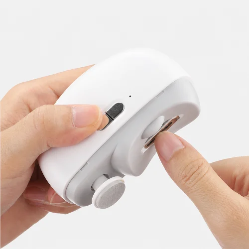 Rechargeable electric automatic nail clipper trimming fingernails safely with precision cutting, USB rechargeable battery, and built-in safety protection for adults and children.