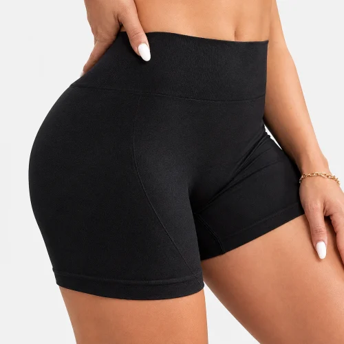 Alt: " Home product image – Acuvick " Close-up view of a woman wearing black Acuvick high-waisted fitness shorts, showcasing the wide tummy control waistband and thick stretch fabric.
